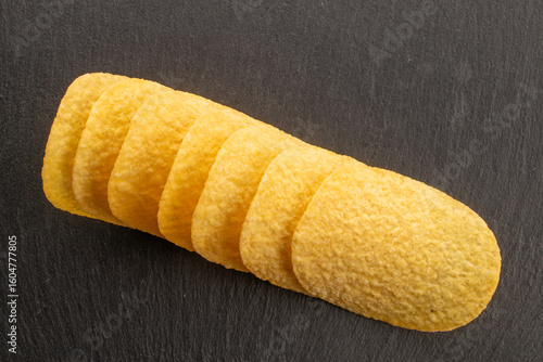 Crispy potato chips, top view, macro.