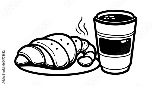 A delicious hot coffee and a fresh croissant make for a perfect morning breakfast