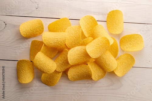 Crispy potato chips, top view, macro.
