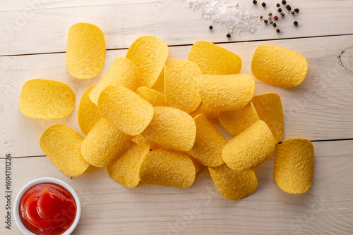 Crispy potato chips, top view, macro.