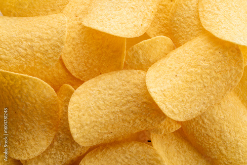 Crispy potato chips, top view, macro.