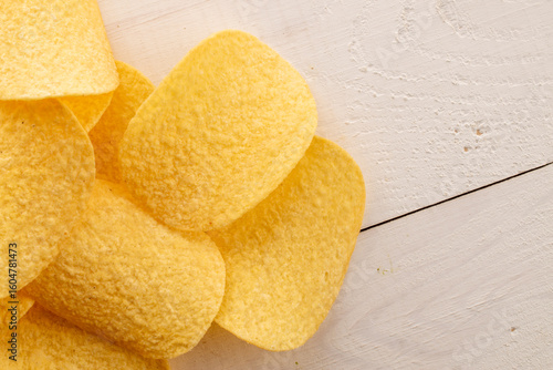 Crispy potato chips, top view, macro.