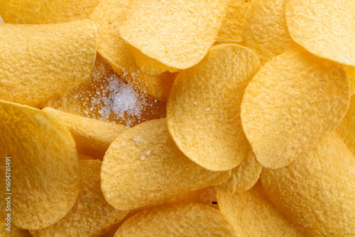 Crispy potato chips, top view, macro.