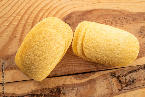 Crispy potato chips, top view, macro.