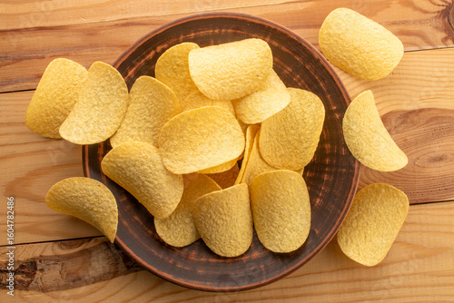 Crispy potato chips, top view, macro.