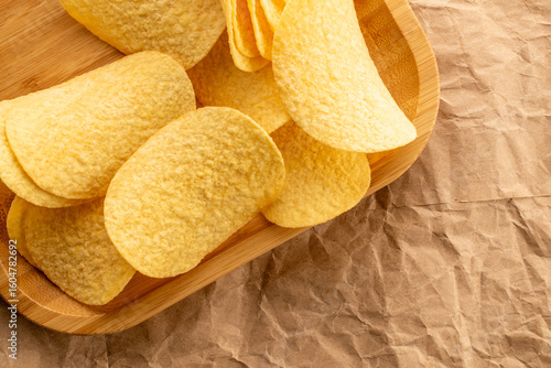Crispy potato chips, top view, macro.