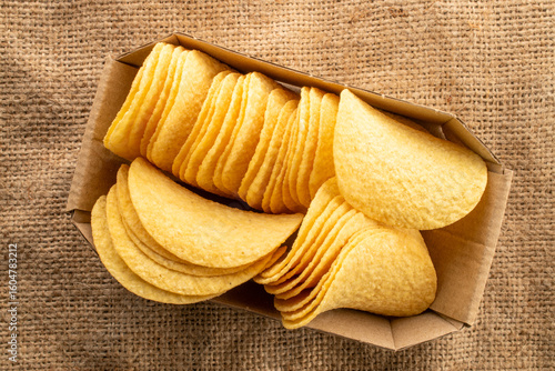 Crispy potato chips, top view, macro.