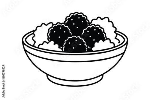 Bowl Of Crispy Falafel On Greens With Tahini