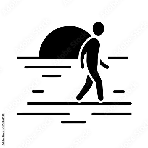 Silhouette of Lonely Man Walking into Horizon at Golden Hour