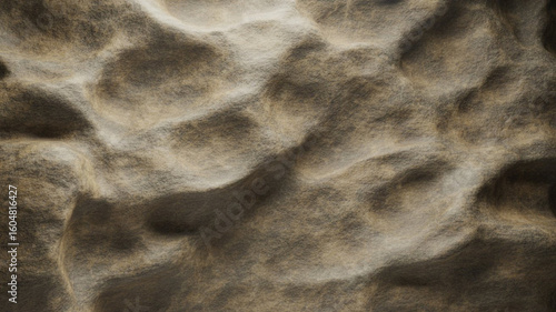 Close-up aerial view of rippled sand dunes, showcasing textures and patterns.