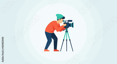 Person in red sweater and teal beanie operating a professional video camera on a tripod