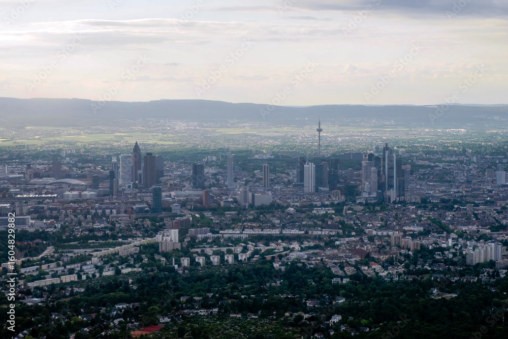 Fototapeta premium Frankfurt Germany city aerial view at sunset from airplane window before landing at airport
