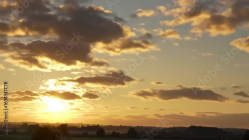 Golden sunset sky with clouds