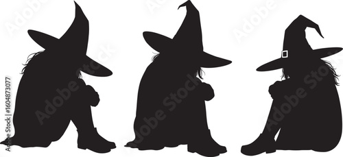 Three witches in pointed hats silhouette