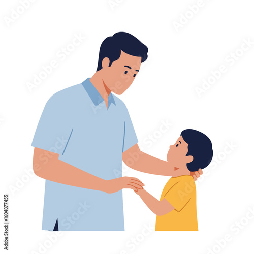 A father comforts his young son, placing a hand on his shoulder and holding his hands in a gesture of reassurance and support.