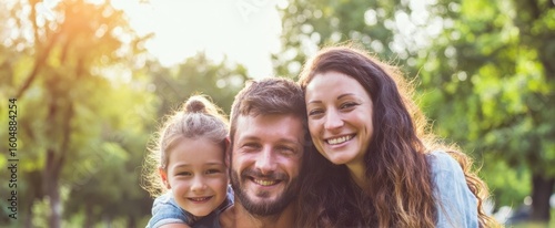 The happy family enjoying a sunny day together in the park.