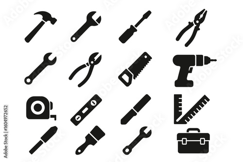 Icon set of black silhouette tools including hammer, wrench, drill, and saw