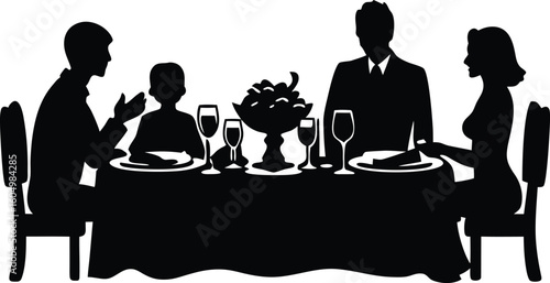 Silhouette of a family having dinner at a table with wine glasses and fruit bowl creating a sense of togetherness
