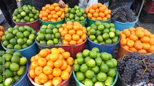 Fresh citrus fruits and grapes at a market