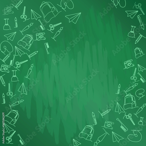 School supplies and educational tools laid out on a green chalkboard background