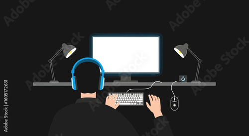 Person Wearing Headphones Working On A Computer In A Dark Room