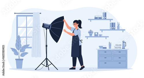 Photographer Setting Up Equipment For a Photoshoot in Her Professional Studio