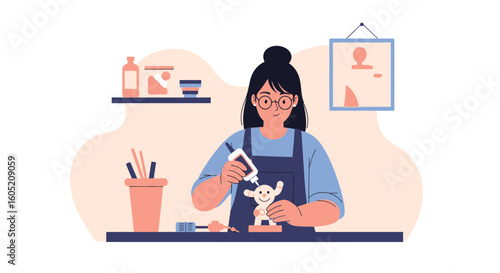 Young Woman Enjoying Her Hobby Making Ceramic Figurines At Home
