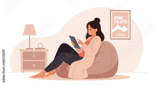 Young Woman Relaxes At Home Using Digital Tablet On Bean Bag Chair