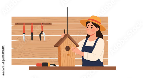 Woman In Overalls Builds A Birdhouse In The Workshop For Garden Decor Activity