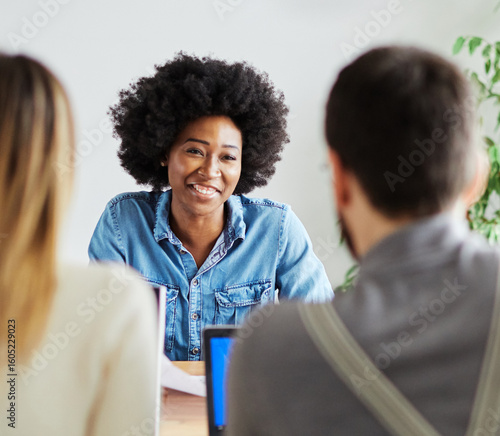 Photos Portrait of a happy young businesswoman during a meeting or job interview in fro