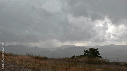 Rain and wind in the mountains, gloomy landscape, hurricane
