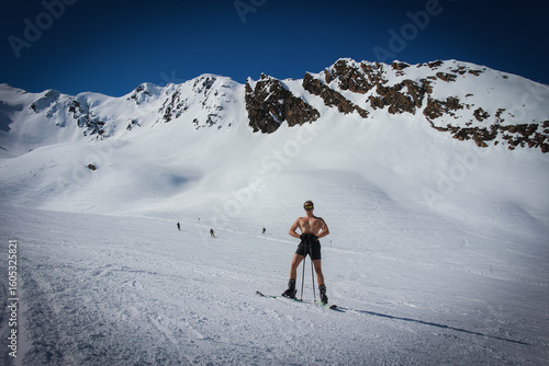 Fit naked skier. High resolution photo.