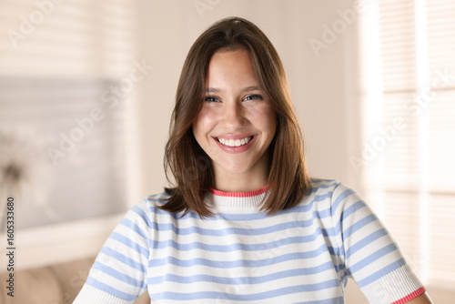 Free Download Portrait of smiling teenage girl at home - GFXLoad