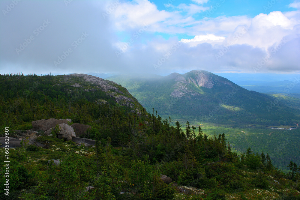 Fototapeta premium Mountain landscape with dramatic clouds and forest in Charlevoix, Quebec, Canada