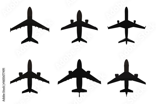 Aerial Aviation Showcase: An impressive top-down view of multiple jet airplanes silhouettes set against the serene expanse. A captivating study of the essence of flight. 