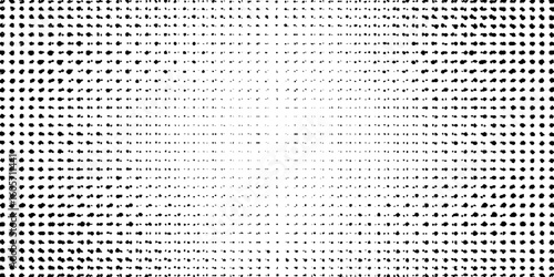 Grunge halftone gradient background faded dotted grit noise texture. Black and white rasterized sand wallpaper.