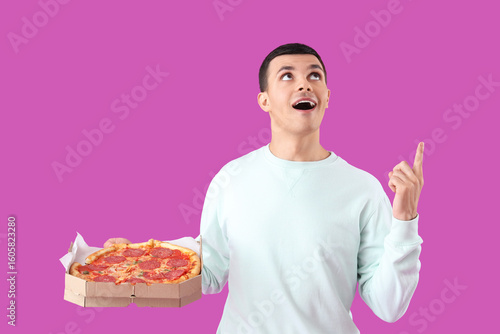 Young man with tasty pepper...