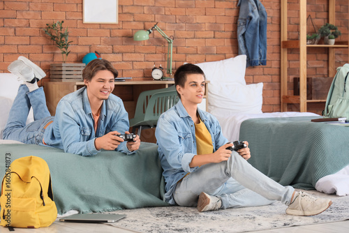 Male students playing video...
