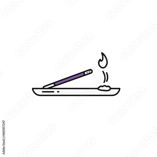 Incense stick burning on a holder, offering a moment of peace and tranquility.