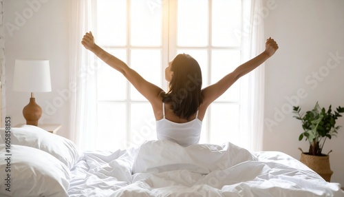 Wallpaper Mural Beautiful young woman waking up in cozy white bedding, stretching with a smile as warm morning sunlight pours through a large window, embracing a peaceful new day Torontodigital.ca