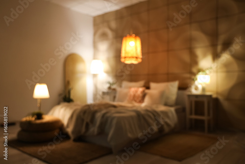Blurred view of stylish bed...