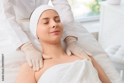 Young woman getting massage...