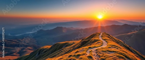 Sunrise over mountain range, path winding upward,  destination,  sunrise
