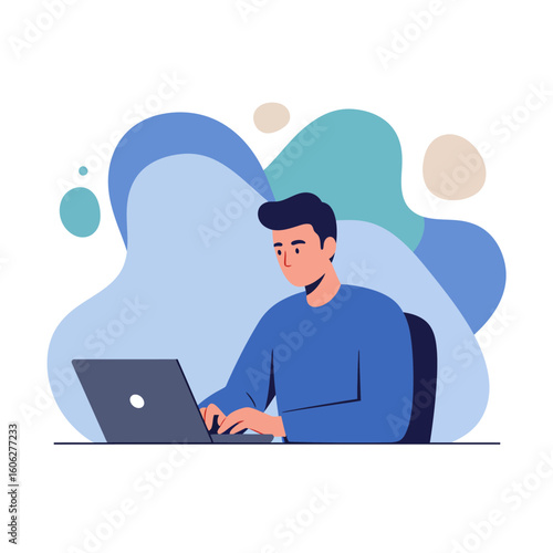 A young man in a blue sweater sits at a desk, focused on working and typing on his laptop computer.