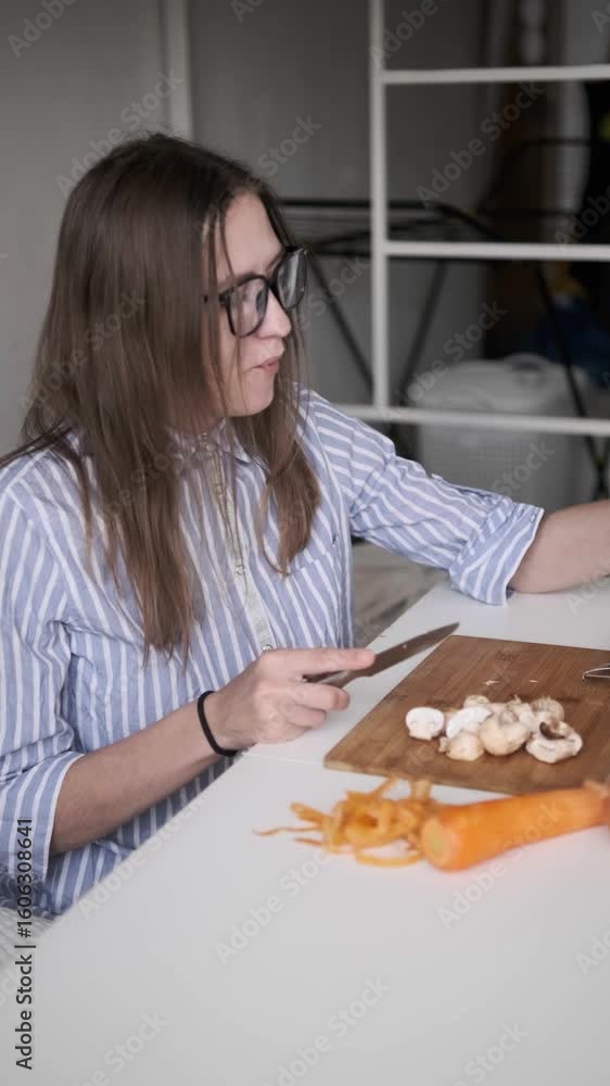 Woman preparing fresh mushrooms in cozy kitchen, healthy cooking at home Woman preparing fresh mushrooms in cozy kitchen, healthy cooking at home