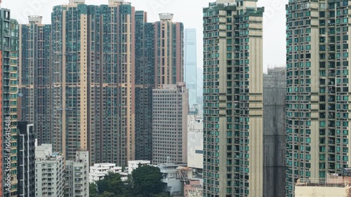 Wallpaper Mural Dense Urban Landscape Of Hong Kong Revealing Residential Buildings, Architectural Diversity, And City Skyline. Crowded High-Rises. Representing City's Architectural Complexity And Population Torontodigital.ca