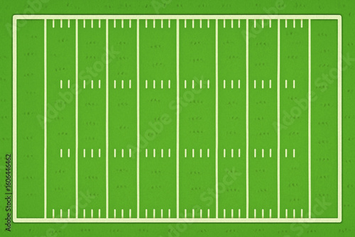 American football field with green grass and ball placed on the field ready for play