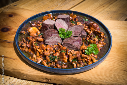 roasted chanterelles and filet from venison with fresh herbs out the garden 
