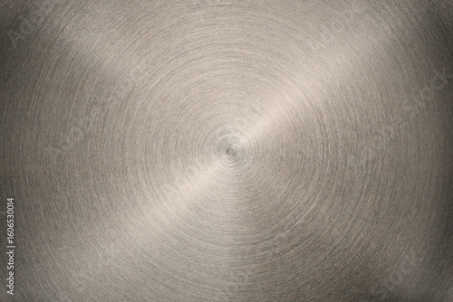 The bottom of a flat heating element of an electric kettle. Extreme close-up of the metal texture.