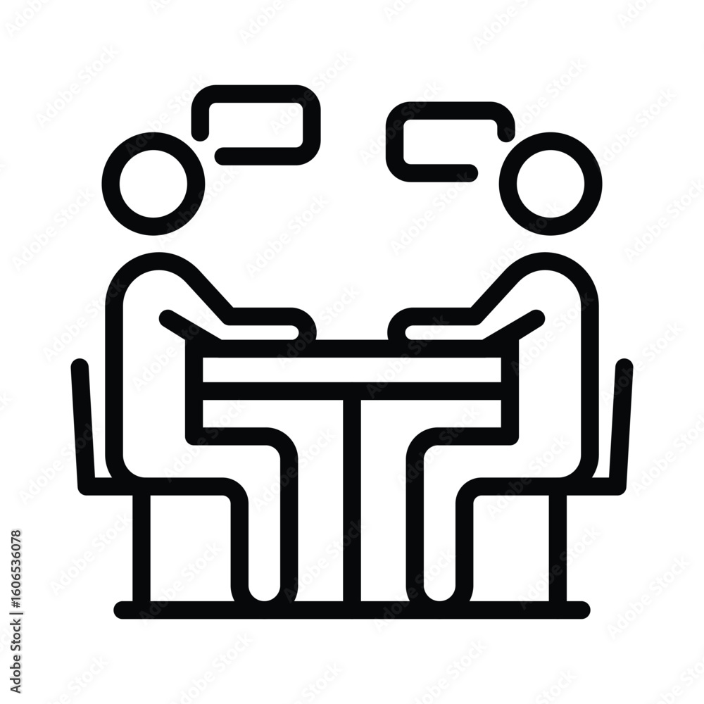 Two People Engaged in a Formal Discussion at a Table Two People Engaged in a Formal Discussion at a Table